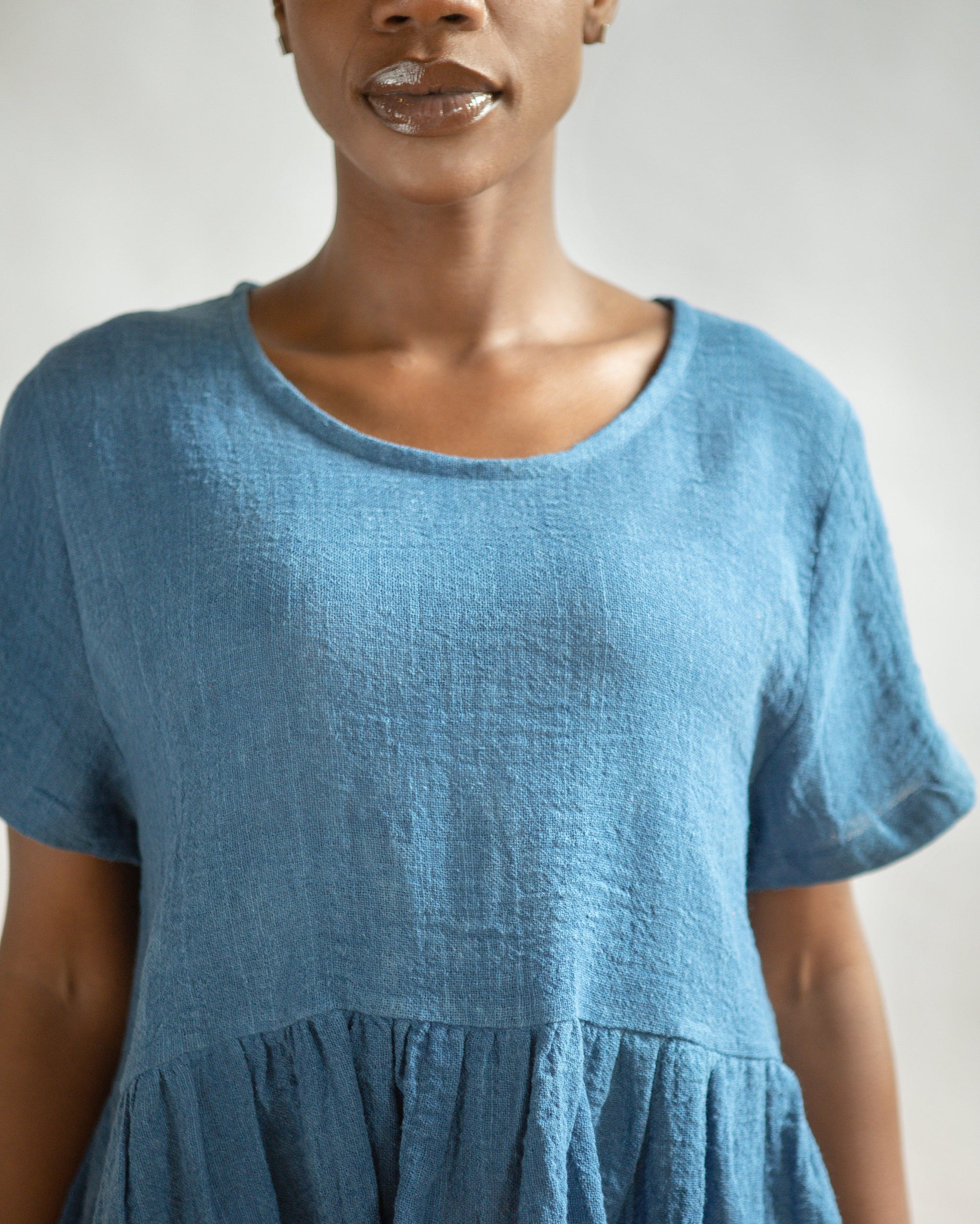 THE INDIGO OMBRE PEPLUM TOP
